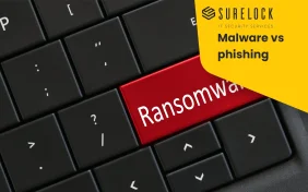 Toetsenbord met de tekst ransomware en malware vs phishing